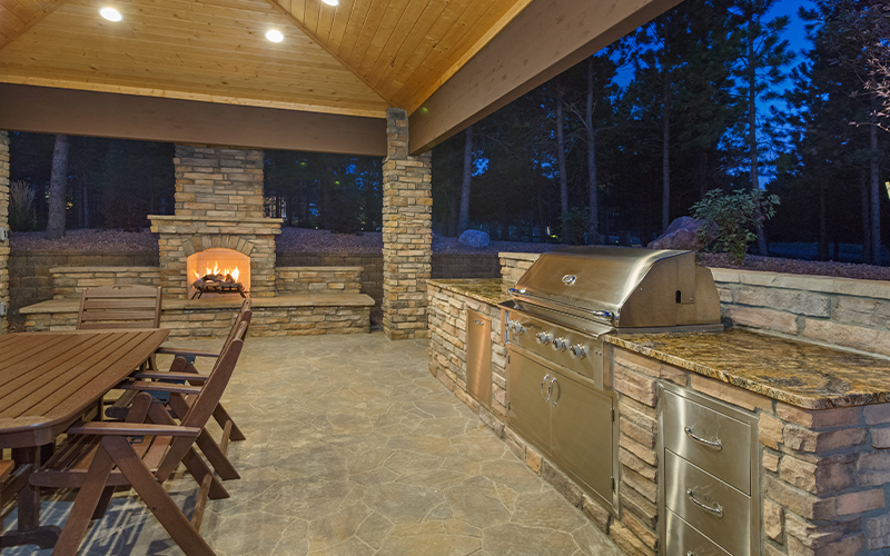 An outdoor kitchen photo taken at night